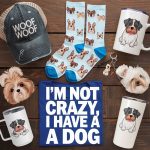photo-of-various-dog-themed-gifts-including a cap, shirt, socks, mug, thumbler, key chain